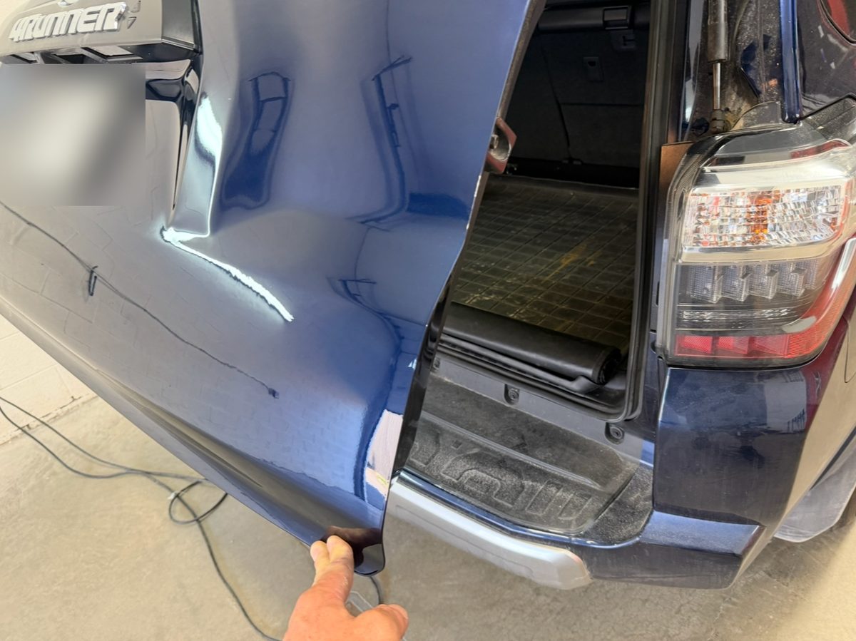 Repaired liftgate of a blue Toyota 4Runner