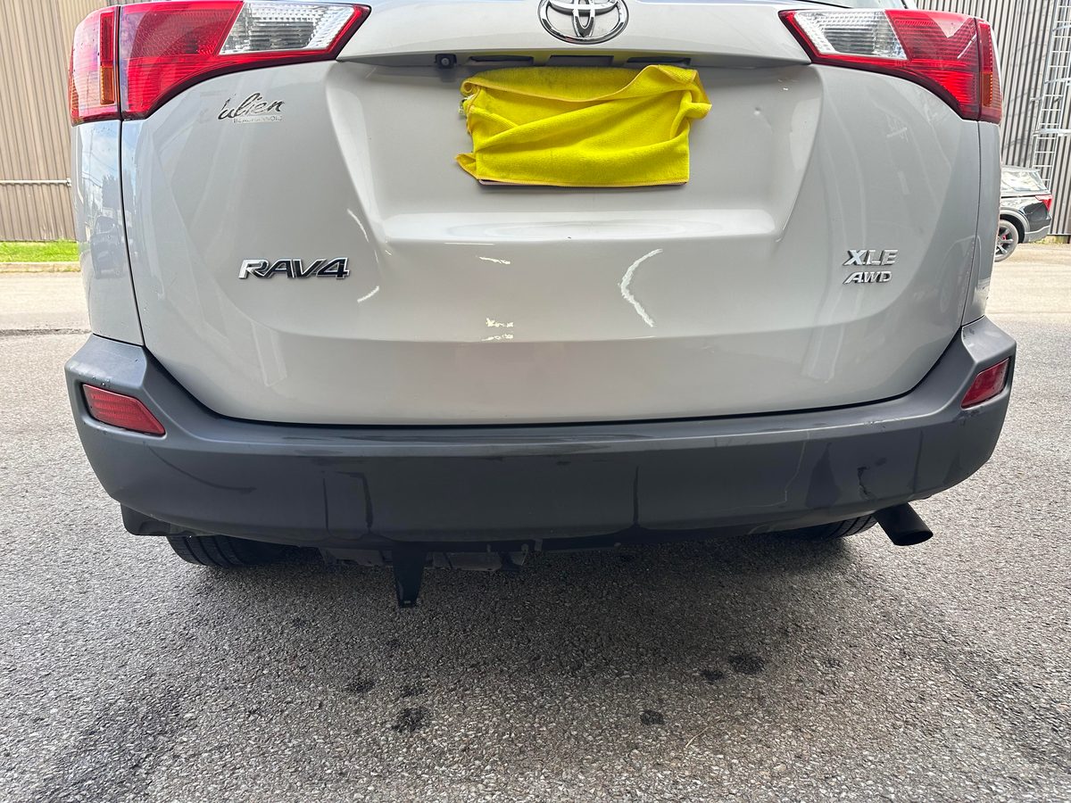 Repaired liftgate of a silver Toyota RAV4