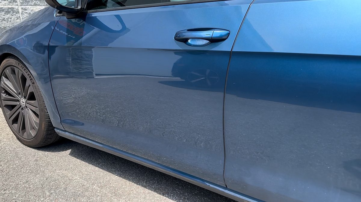 Repaired front door of a grey Volkswagen
